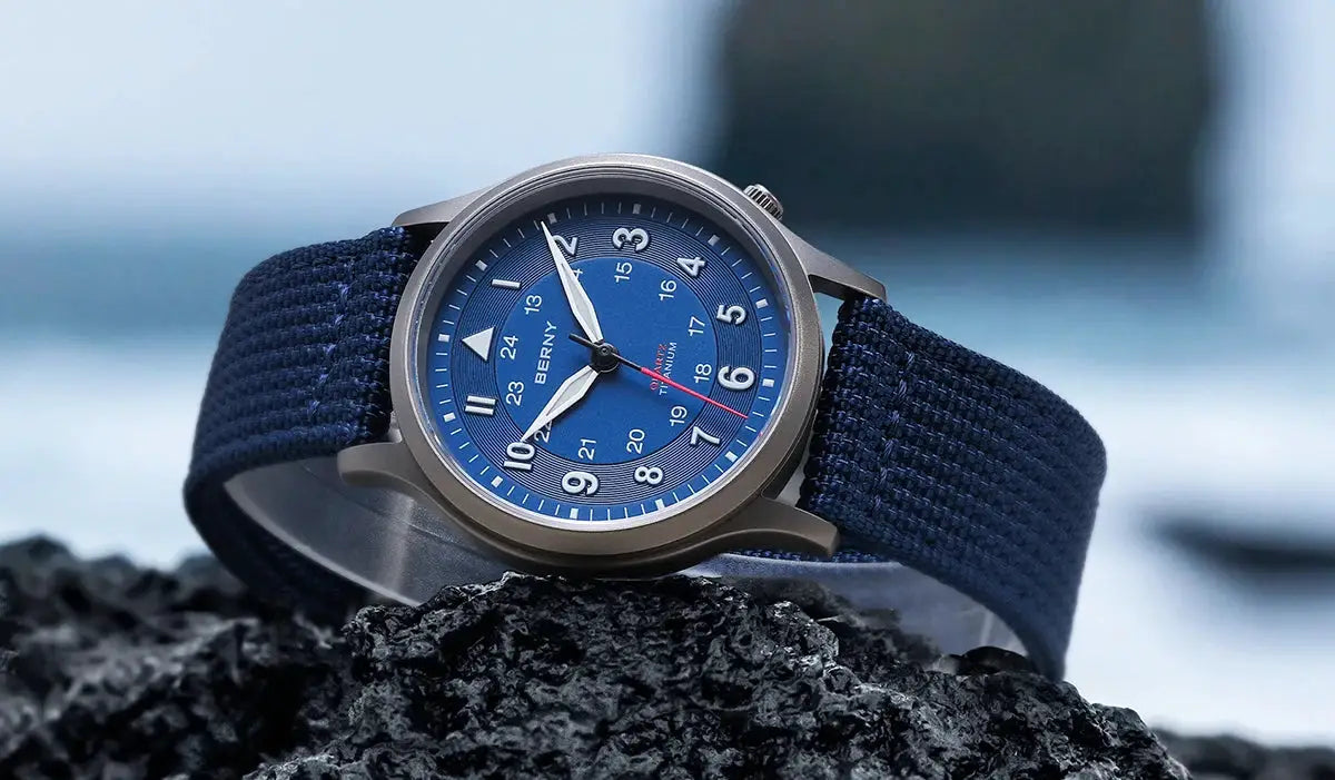 BERNY men's full titanium field watch with blue dial, navy fabric strap, and luminous hands
