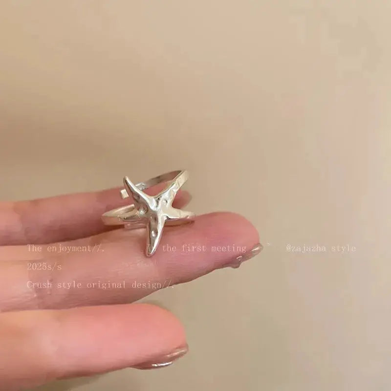 Silver star-shaped open ring with goth-punk retro vibe for women.