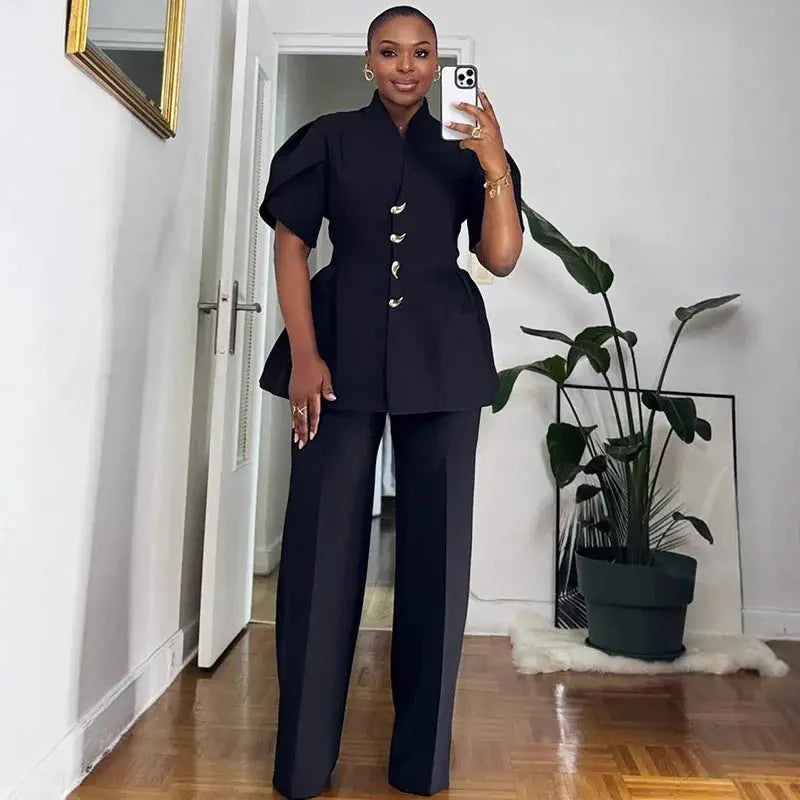 Two-piece women's office suit with puff-sleeve blazer and wide-leg pants in black