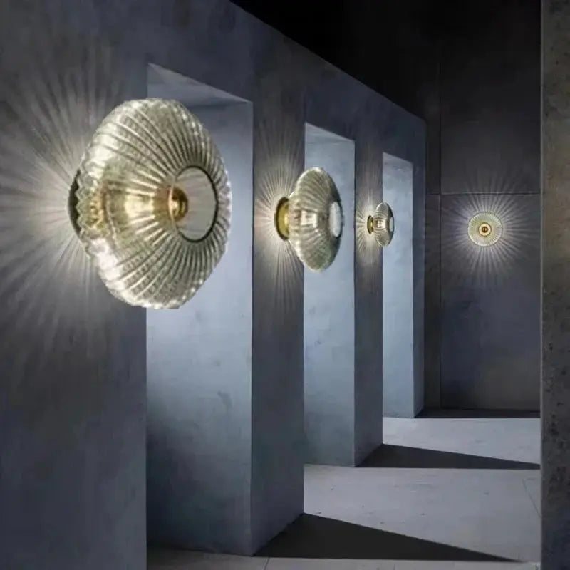 Nordic LED glass wall sconce set of four by Simples Market; ribbed circular shade casts radial light on gray walls