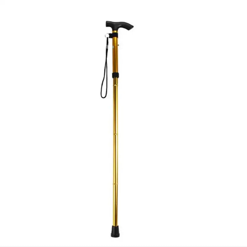 Telescopic walking stick by Simples Market, gold aluminum alloy hiking pole with black handle and wrist strap.