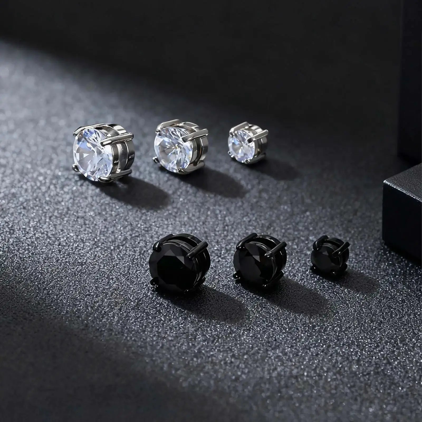 Punk round zircon magnetic ear studs set in stainless steel with clear stones and black variants