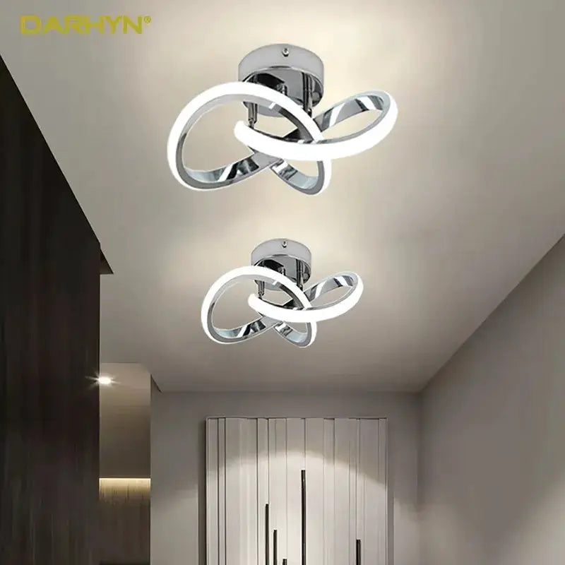 LED ceiling light fixture by Darhyn with intertwined loop rings in chrome finish; two units
