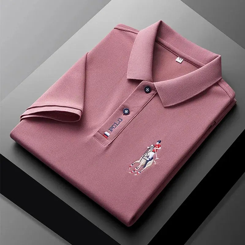 Men's pink polo shirt with Polo pony embroidery and navy button placket.