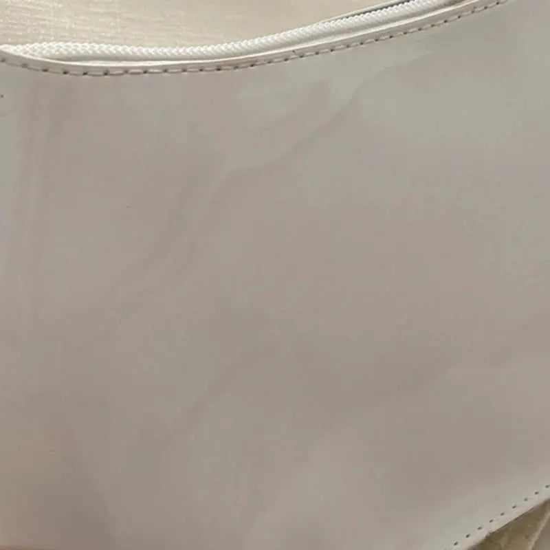 Beige PU leather shoulder bag with visible zipper edge.