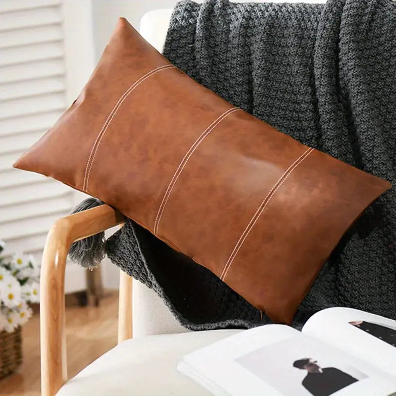 Brown faux leather throw pillow cover, large rectangular with white stitching for modern boho farmhouse decor.