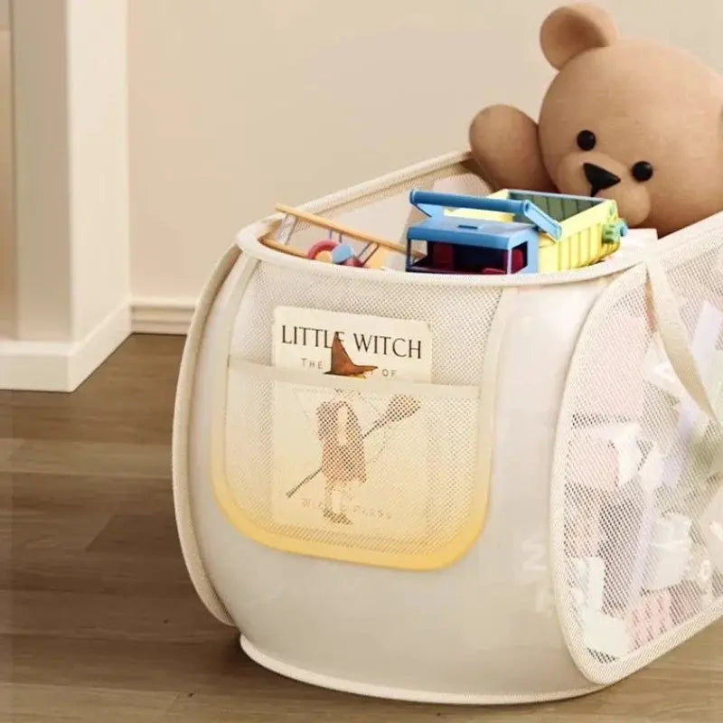 Portable large-capacity storage bin toy organizer by Simples Market in white mesh with yellow trim, holding plush toys.