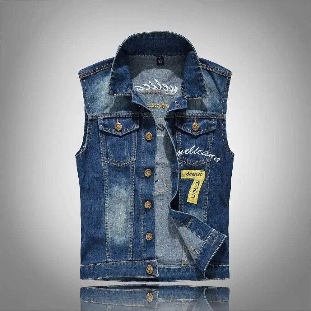 Blue denim sleeveless men's vest with button front, chest pockets, contrast stitching and patches.
