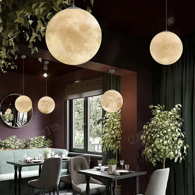 Nordic Moon LED Pendant Lights by Simples Market; 4 warm beige moon-shaped hanging lamps for dining and living spaces