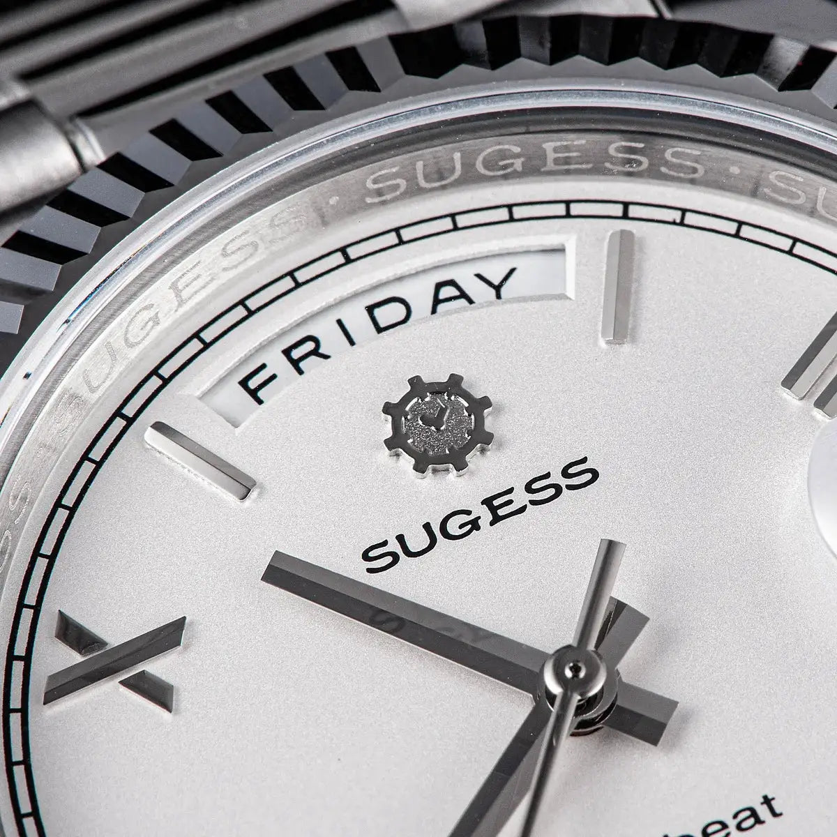 Sugess men's wristwatch with silver dial, day window showing Friday, stainless steel case and sapphire glass