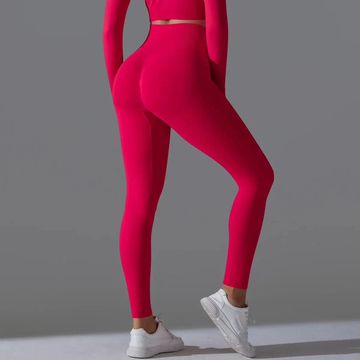 Women's seamless yoga leggings in hot pink, high-waisted tummy-control design