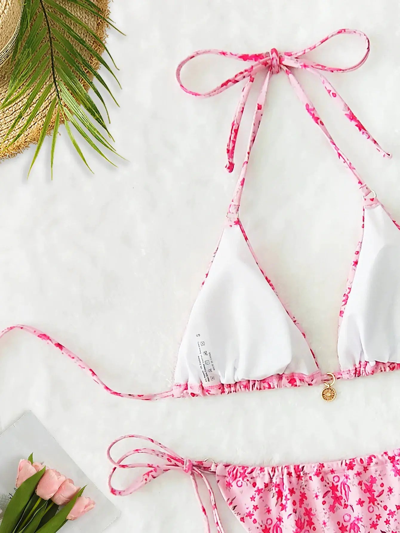 Triangle bikini set by Simples Market in white with pink floral trim; floral print Brazilian bottoms