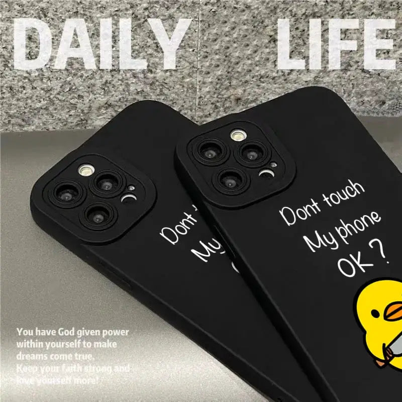 2 black silicone duck phone cases for iPhone, cute minimalist cartoon design with white text and yellow duck illustration