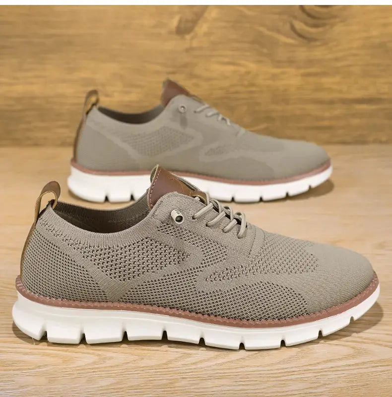 A pair of men's breathable taupe mesh casual sneakers with white chunky sole and brown trim (plus sizes 50-54)