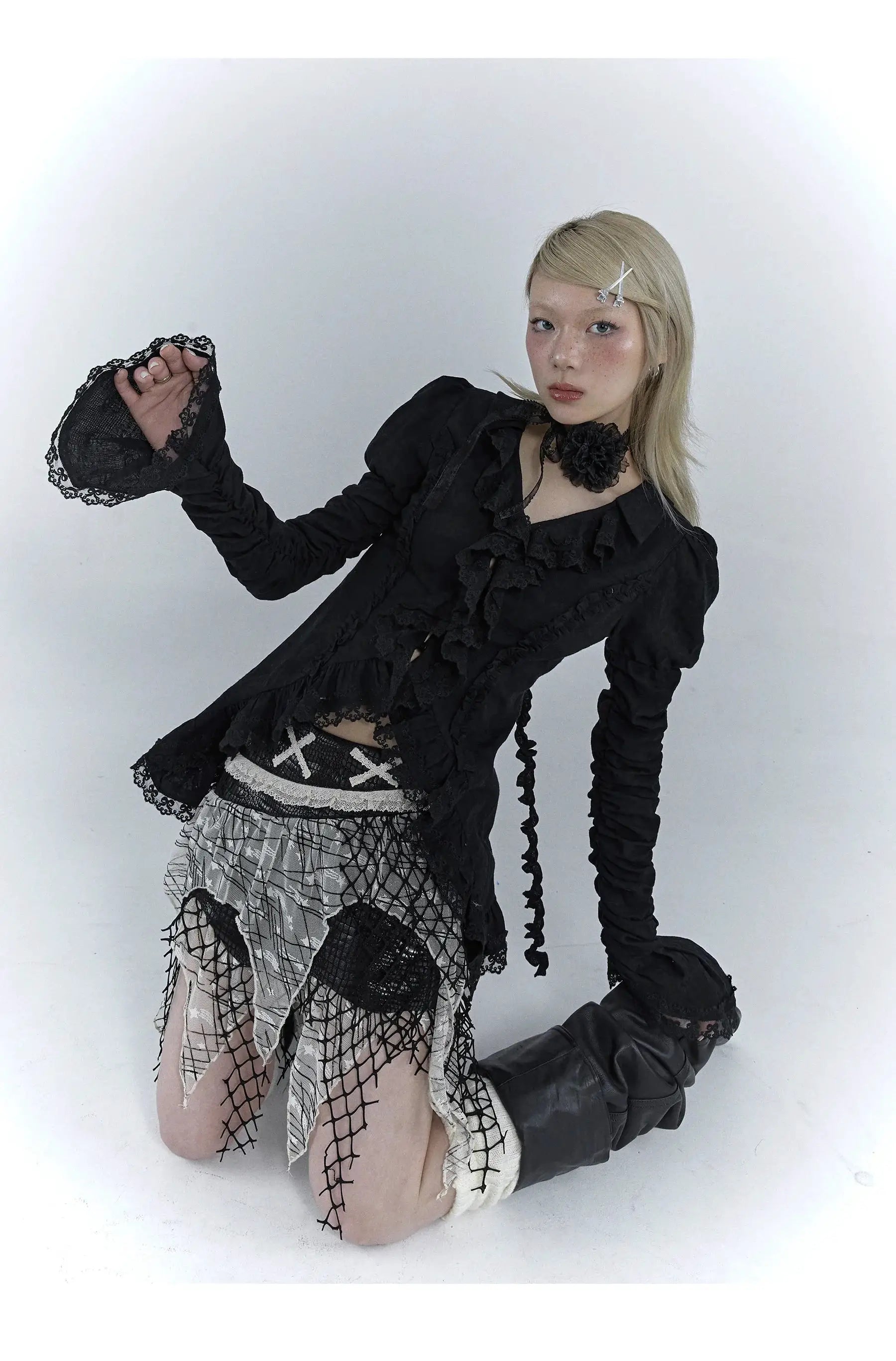 Karrcat Gothic black lace shirt with V-neck, ruffled front and long ruched sleeves; paired with a mesh layered skirt.