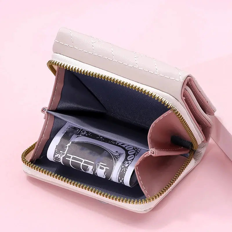 Women's PU tri-fold wallet with pink quilted exterior and gold zipper