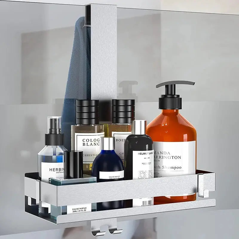 Simples Market movable bathroom shelf organizer in silver steel mounted on glass shower wall, holds multiple bottles.