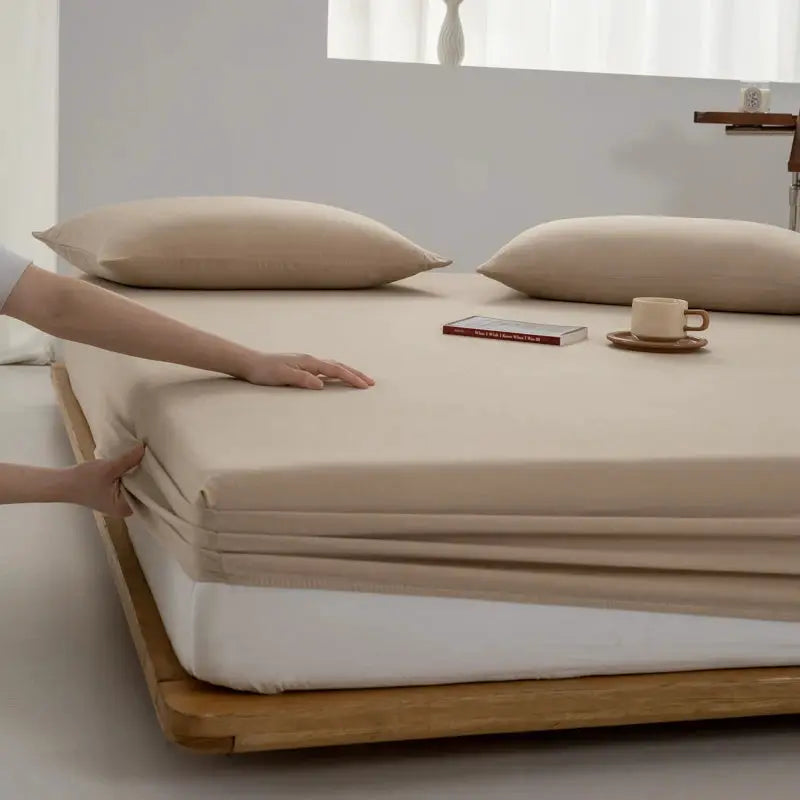 Simples Market beige soft cotton fitted sheet with elastic band on a wooden platform bed