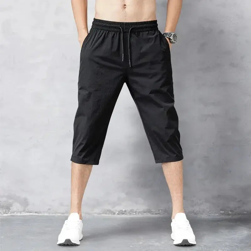 Men's 3/4 length black shorts with elastic drawstring waistband