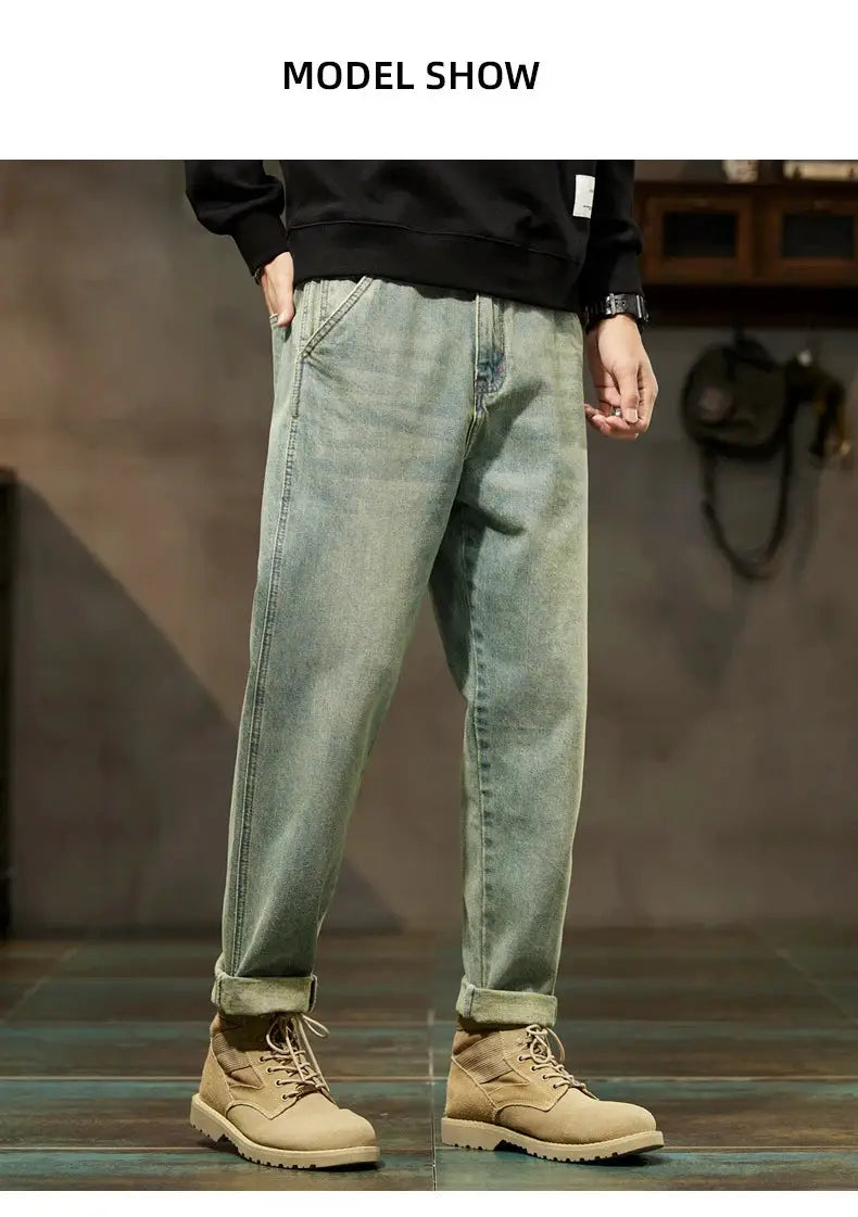Men's loose denim jeans with Harajuku straight-leg fit, light blue wash, rolled cuffs.