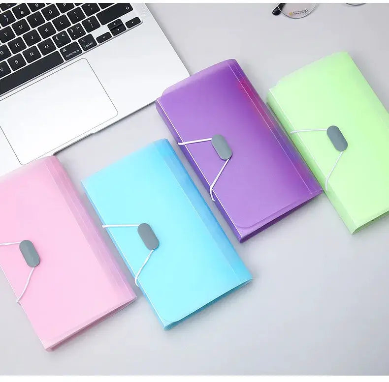Set of four A6 expanding file folders with buckle closures in pink, light blue, purple, and green
