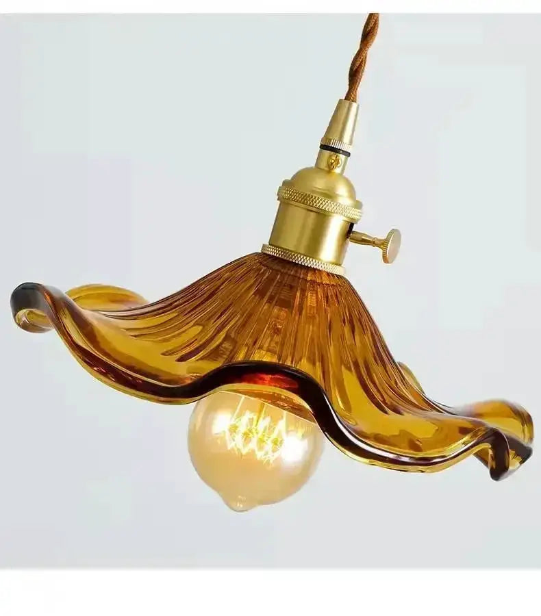 Nordic minimalism LED pendant light with amber glass wave shade and brass-tone fixture