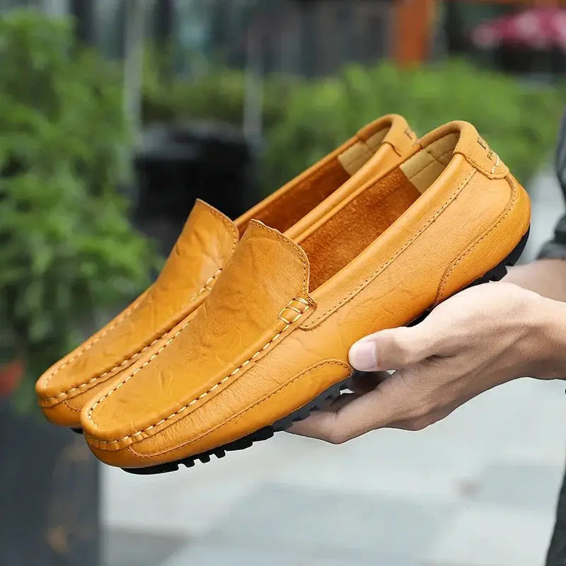 Pair of tan genuine leather men's loafers, breathable slip-on moccasin-style driving shoes