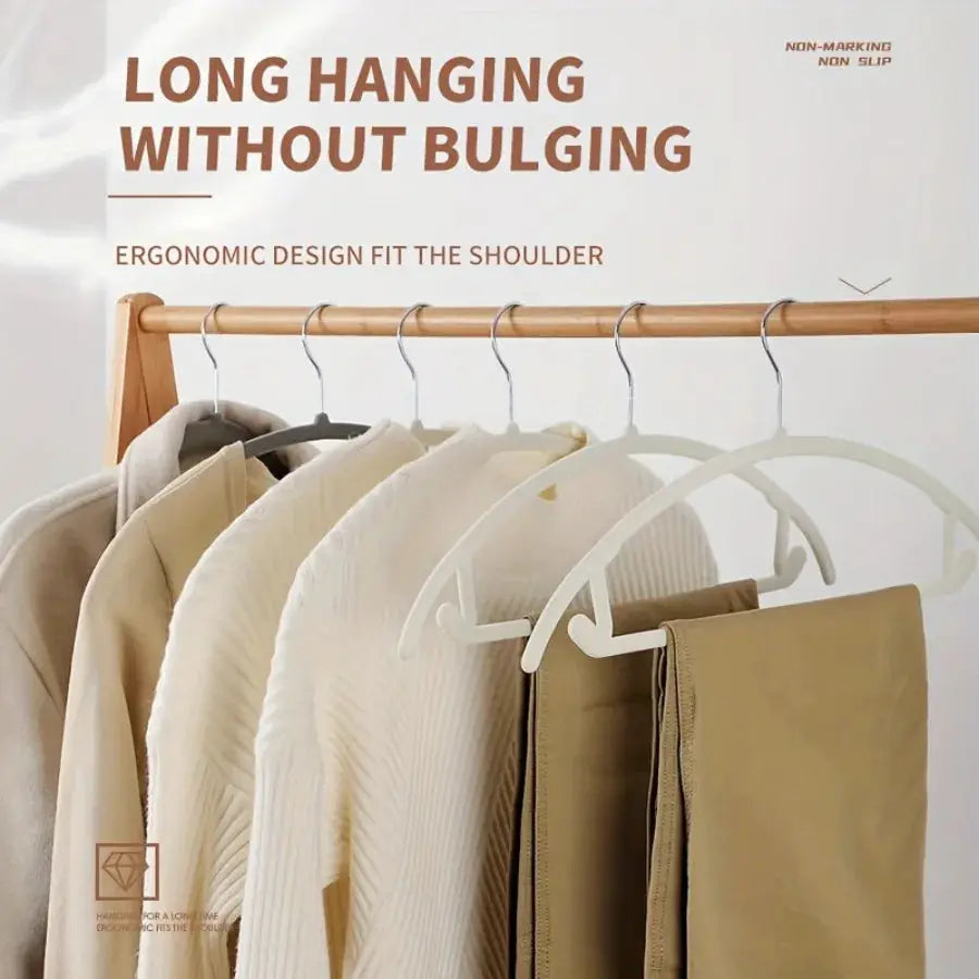 White plastic hangers, six-piece set for closet organization, space-saving design.