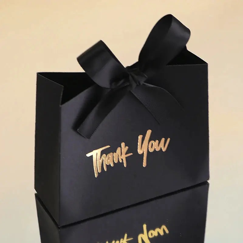 Black gift box with gold Thank You inscription and black satin ribbon bow