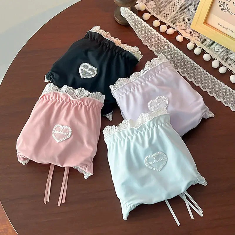 Simples Market 4-pack plus-size lace panties set in black, pink, lavender, and mint with white lace trim and heart embroidery