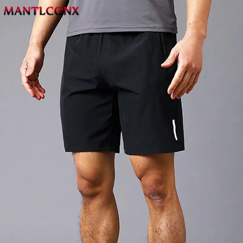 Men's quick-dry black jogging shorts, lightweight breathable with white reflective stripe, MANTLCONX