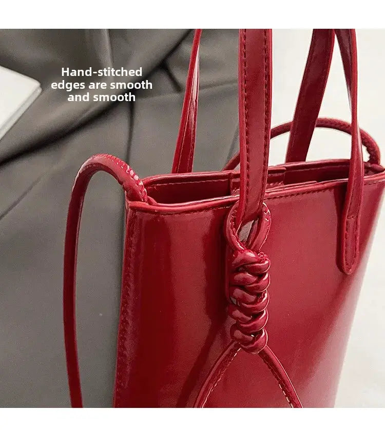 PU Leather mini crossbody bag for women, red, with knotted strap detail.