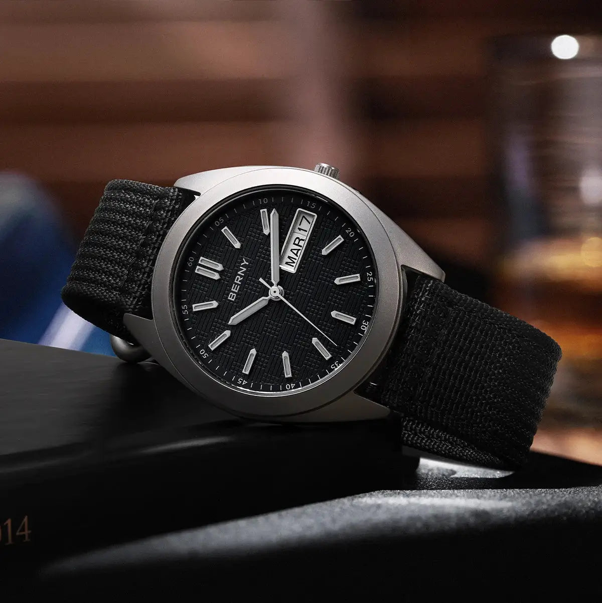 BERNY titanium men's watch with black textured dial, date window, luminous hands, metal case, black fabric strap