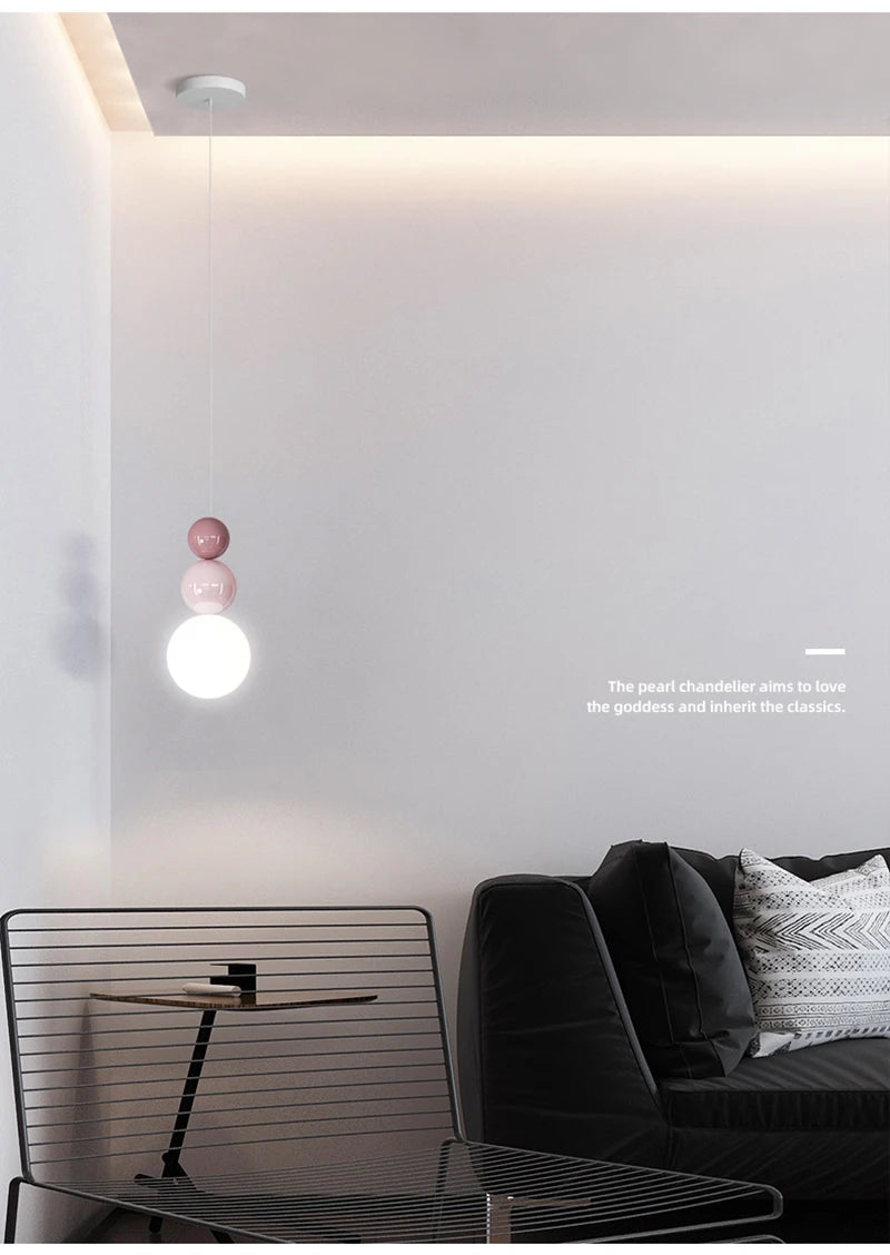 Nordic pendant light with cream-pink bead accents and a white LED globe