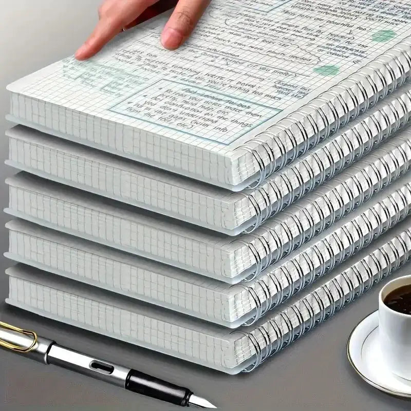 Grid notepad A5 spiral notebooks stacked; six grid-page drawing and writing pads.