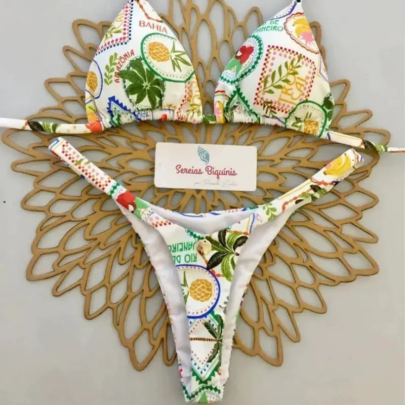 Simples Market print bikini set with halter top and thong bottoms in a multicolor tropical pattern
