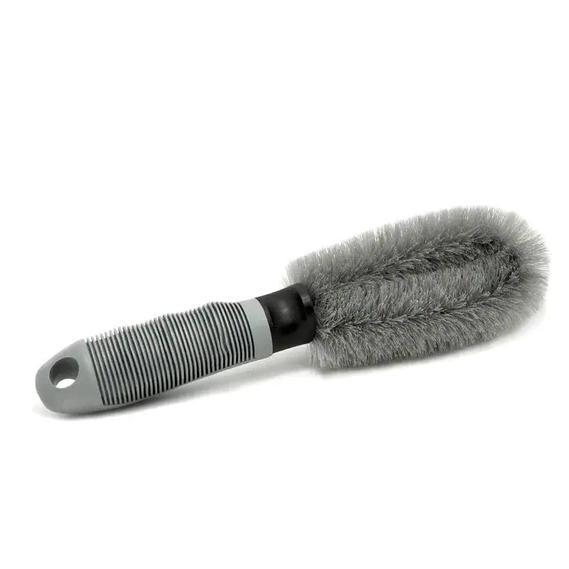 Car wheel cleaning brush with gray bristles and ergonomic ribbed handle