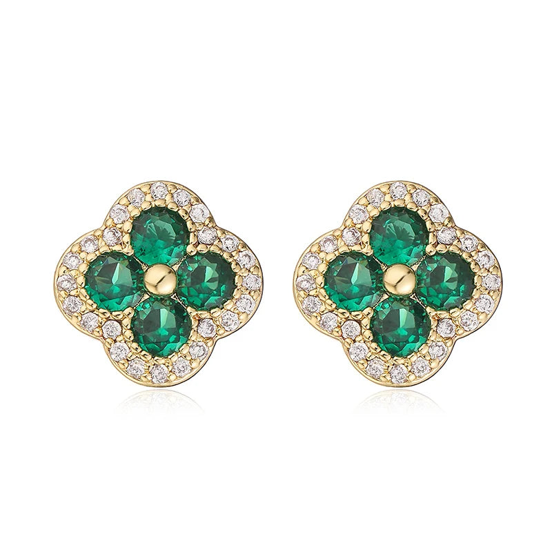 Pair of gold-plated flower-shaped earrings with emerald green CZ stones and a clear crystal halo