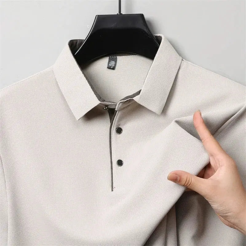 Beige men's long-sleeve polo shirt with collar and button placket, textured knit fabric
