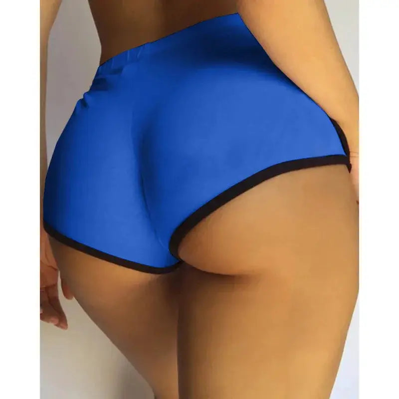 Blue high-stretch women's gym shorts with black trim by Simples Market.