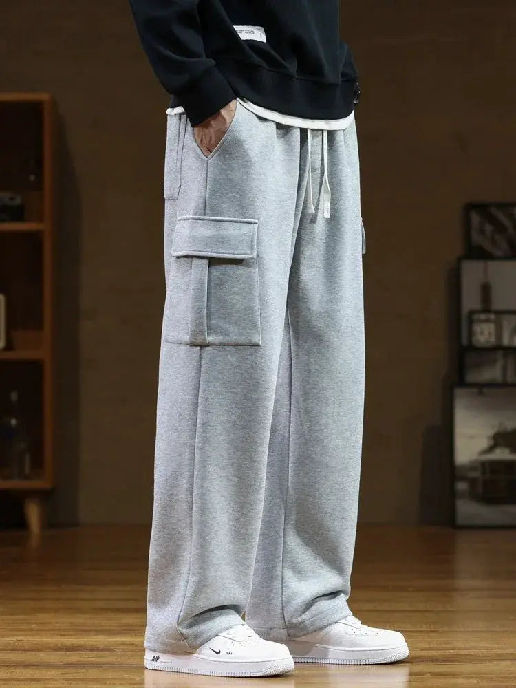 Men's gray cotton cargo sweatpants with multiple pockets, drawstring waist, loose straight fit