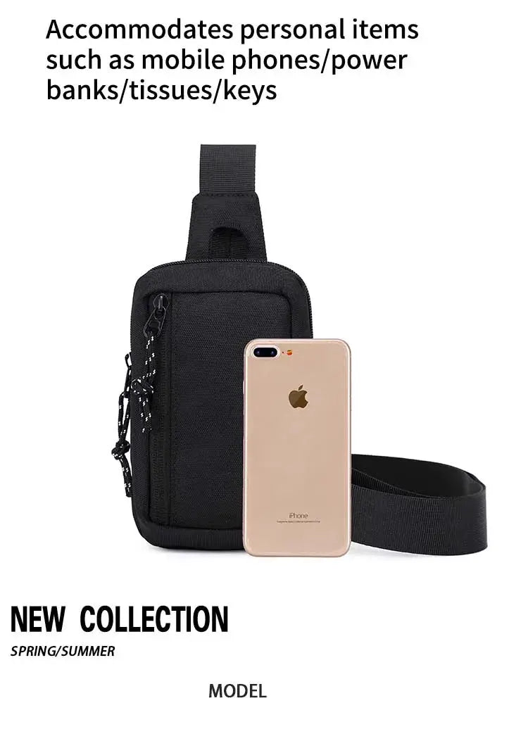 Crossbody bag by Simples Market in black with adjustable strap and front zip pocket.