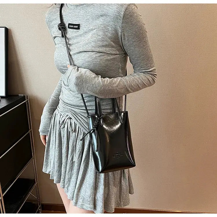 PU Leather Mini Crossbody Bag in black with a compact silhouette and long shoulder strap