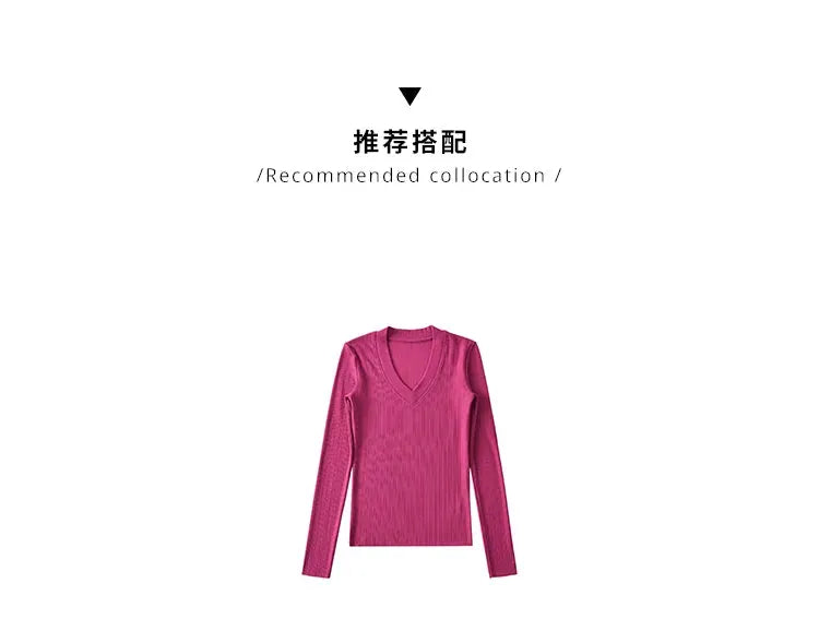 Pink ribbed knit V-neck sweater with long sleeves for women.