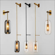 Modern glass wall light sconce set of 5 in gold and black finishes with clear and smoky glass shades by Simples Market