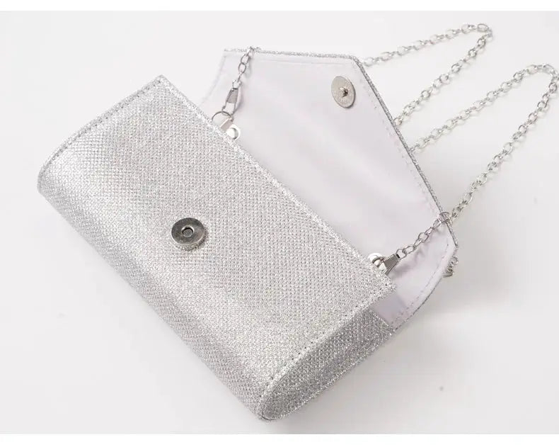 Envelope evening bag by Simples Market in silver glitter with chain strap