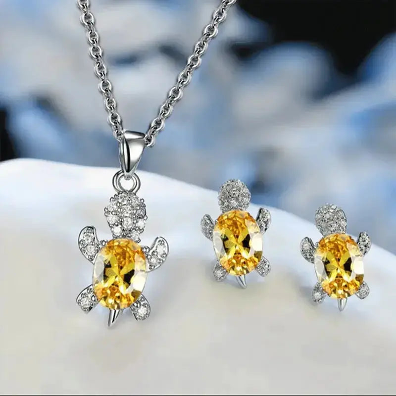 3pc turtle-shaped jewelry set: silver-plated necklace and matching earrings with yellow gemstone and crystal accents