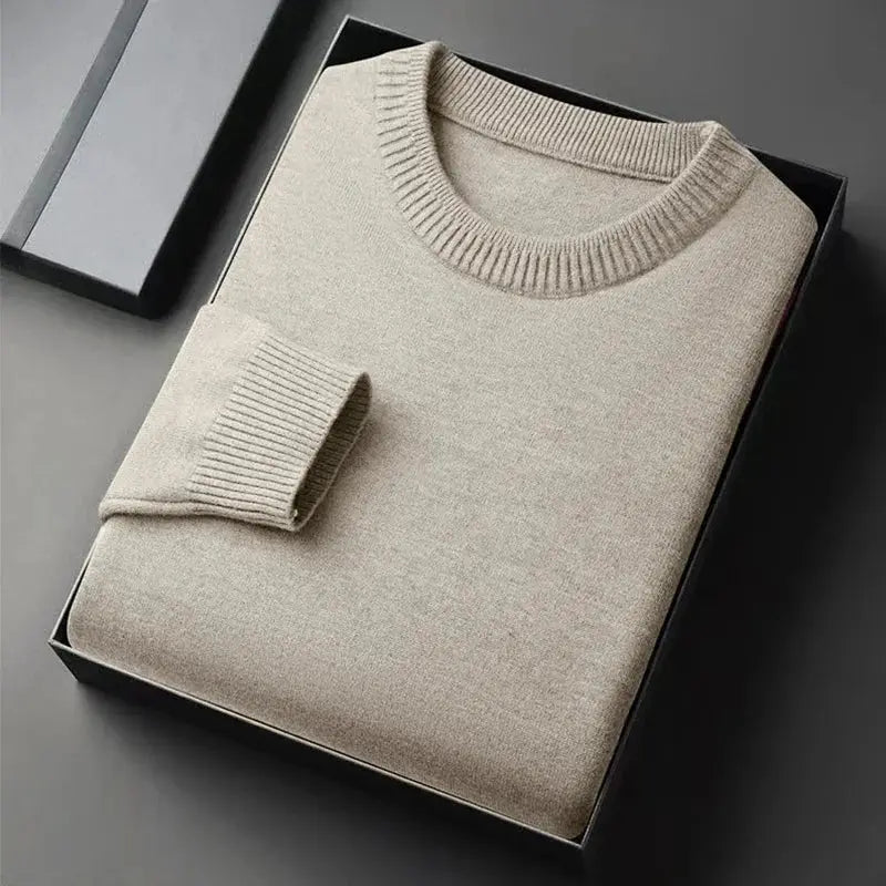 Beige men's crewneck knit pullover sweater by Simples Market, lightweight solid color, folded in box.