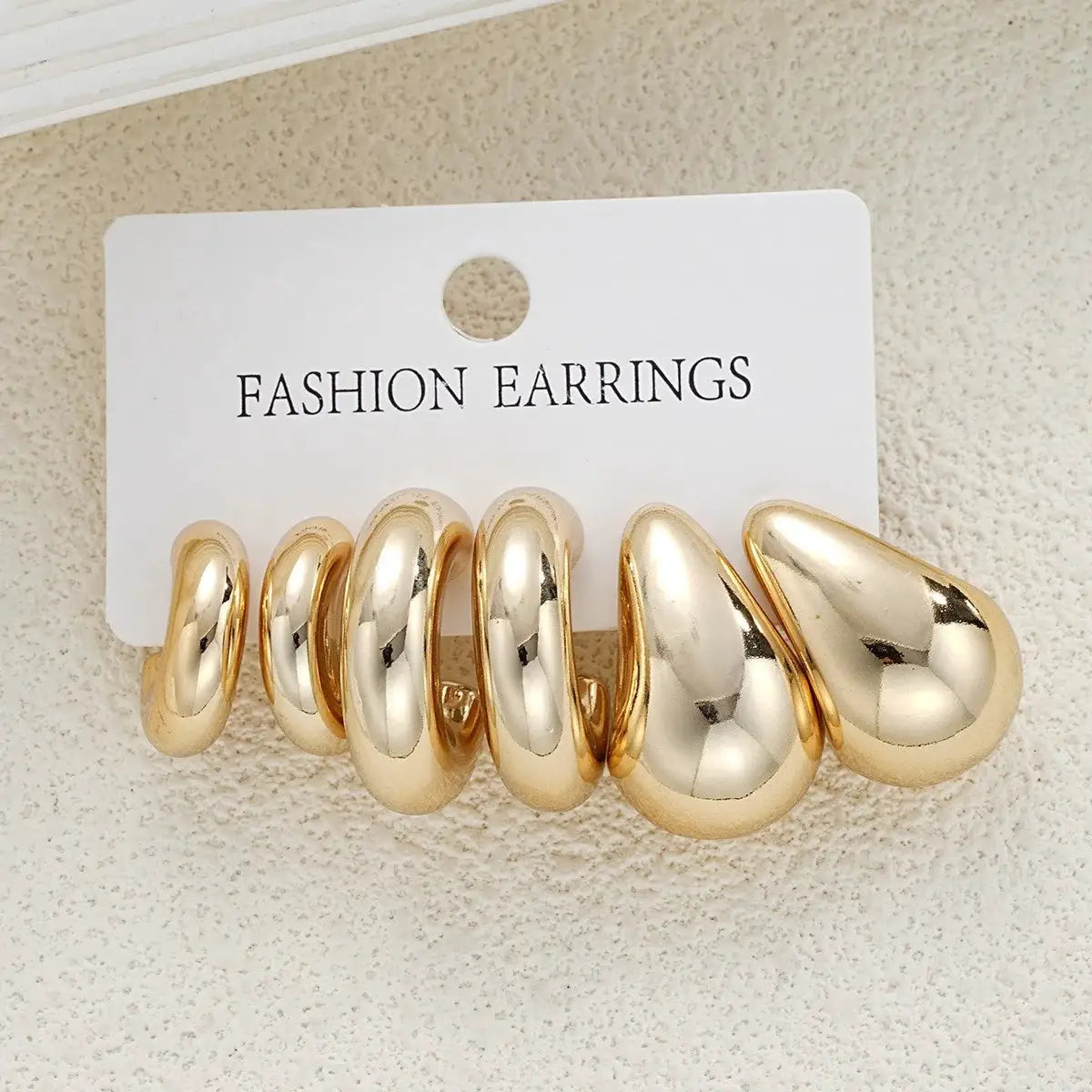 Gold-tone teardrop earring set with stacked hoops, lightweight vintage fashion for women