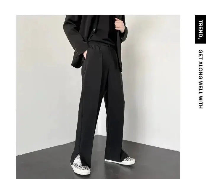 Men's straight baggy casual pants in black; relaxed streetwear style with a formal vibe.